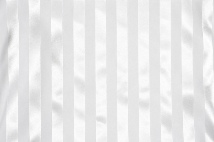 White fabric with vertical satin-like stripes and soft folds.