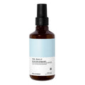 Brown spray bottle with a light blue label on a white background