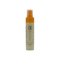 Spray bottle with orange nozzle and visible 'GK' branding on a white background