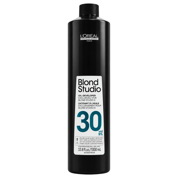 A 1000 mL black bottle of L'Oréal Professionnel Paris Blond Studio 30% peroxide hair developer on a solid white background.